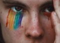 closeup photography of person with rainbow eyeshadow