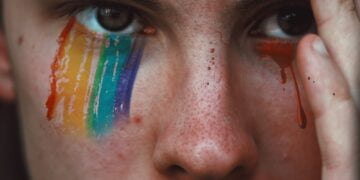 closeup photography of person with rainbow eyeshadow